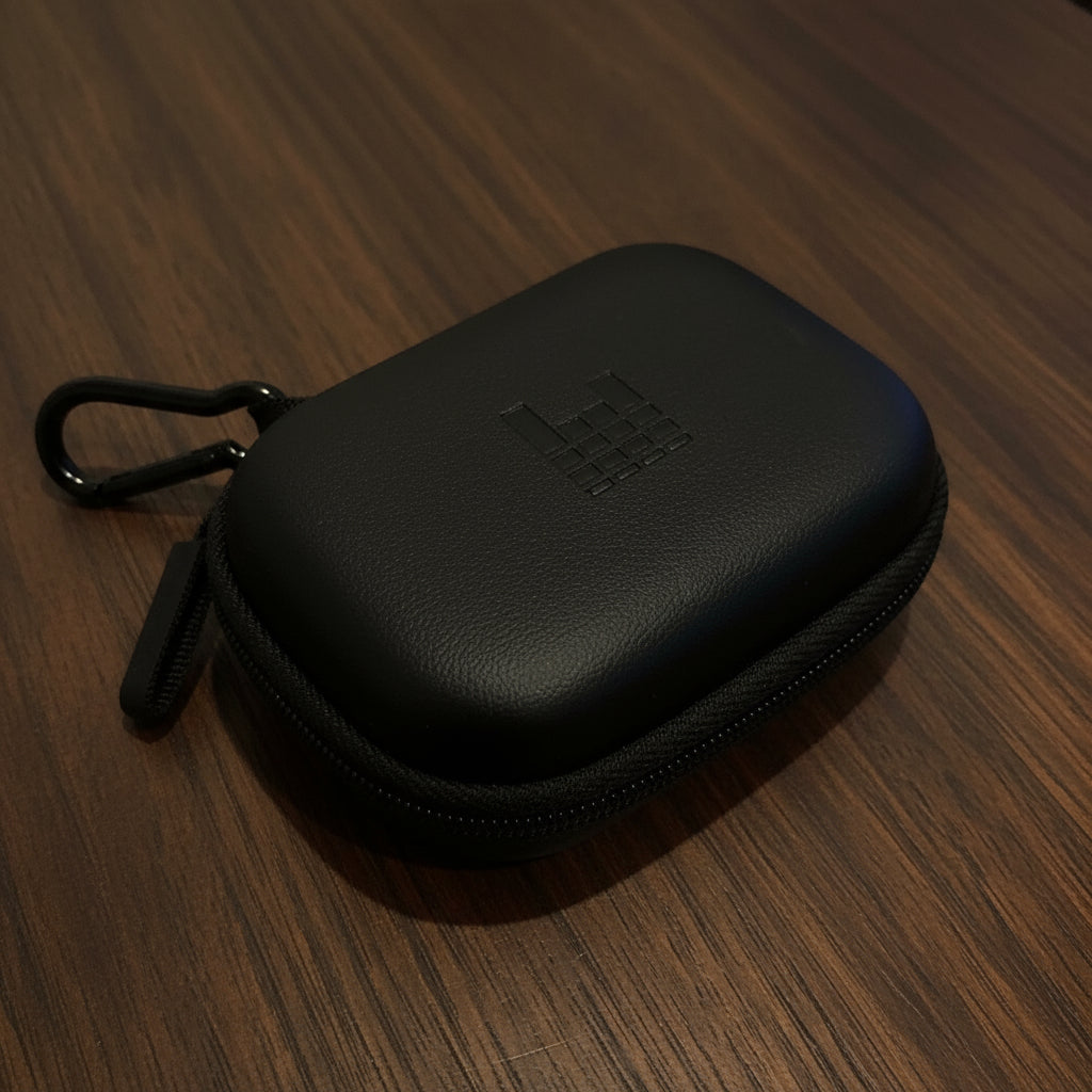Black hard-shell carrying case with a brand logo on a light gray background